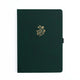 Dark green notebook with a gold floral design on a white background