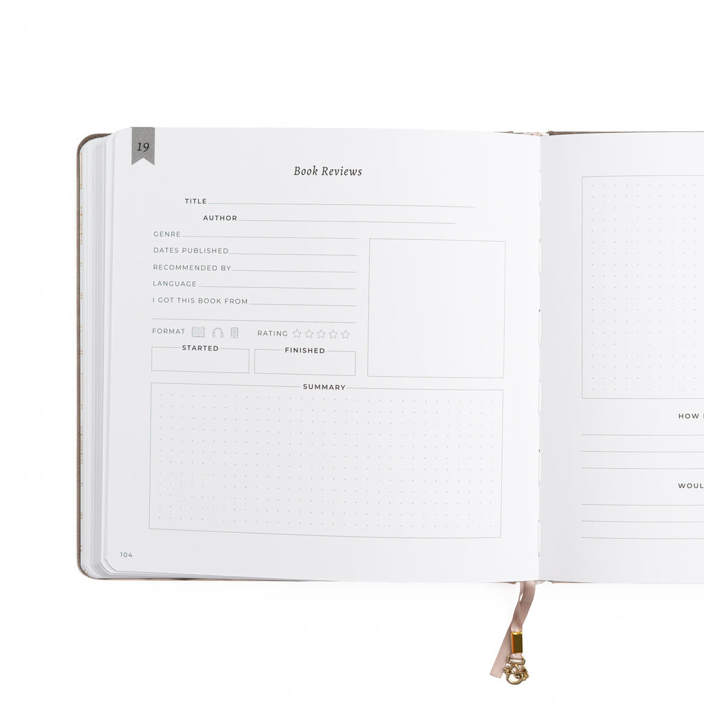 Open notebook with a page titled 'Book Reviews' on a white background